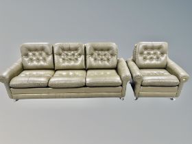 A 1970's buttoned olive leather three seater settee on chrome feet together with matching armchair