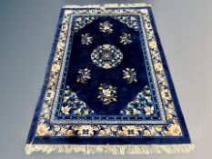 A Chinese carpet on Indigo ground 216 cm x 138 cm