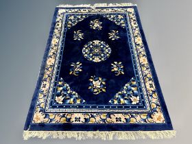 A Chinese carpet on Indigo ground 216 cm x 138 cm
