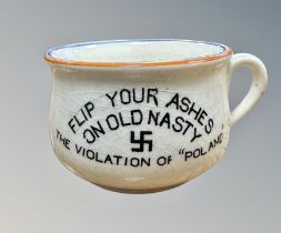 A small novelty Fieldings ash pot, 'Flip your ashes on Old Nasty, The Violation of Poland',