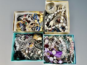 A large quantity of costume jewellery, beaded necklaces,