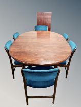 A 20th century extending dining table with two leaves and set of six dining chairs