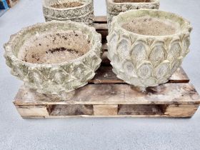 Two weathered concrete garden planters,