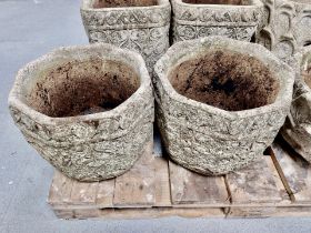 A pair of weathered concrete octagonal garden planters,