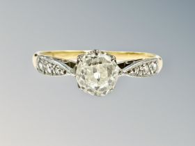 An 18ct gold and platinum diamond solitaire ring, the old-cut stone weighing approximately 0.