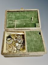 A musical jewellery box containing costume jewellery