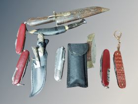 A miniature kukri knife and other knives to include Swiss Army knife,