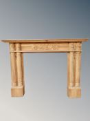 A carved pine fire surround,