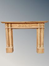 A carved pine fire surround,