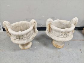 A pair of concrete twin handled urn planters height 51 cm