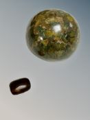 A polished rainforest jasper from Australia and a small piece of amber