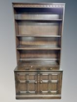 An Ercol stained elm bookcase,