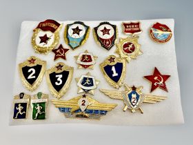 A group of sixteen officers and enlisted men qualification and excellence badges