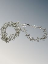A 925 silver chain mail bracelet together with 925 bracelet with links made of musical notes