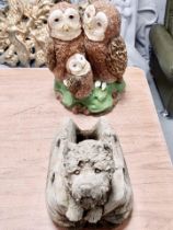 Two concrete garden ornaments in the form of a group of owls and dog