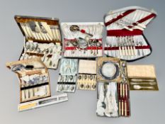 A collection of boxed cutlery