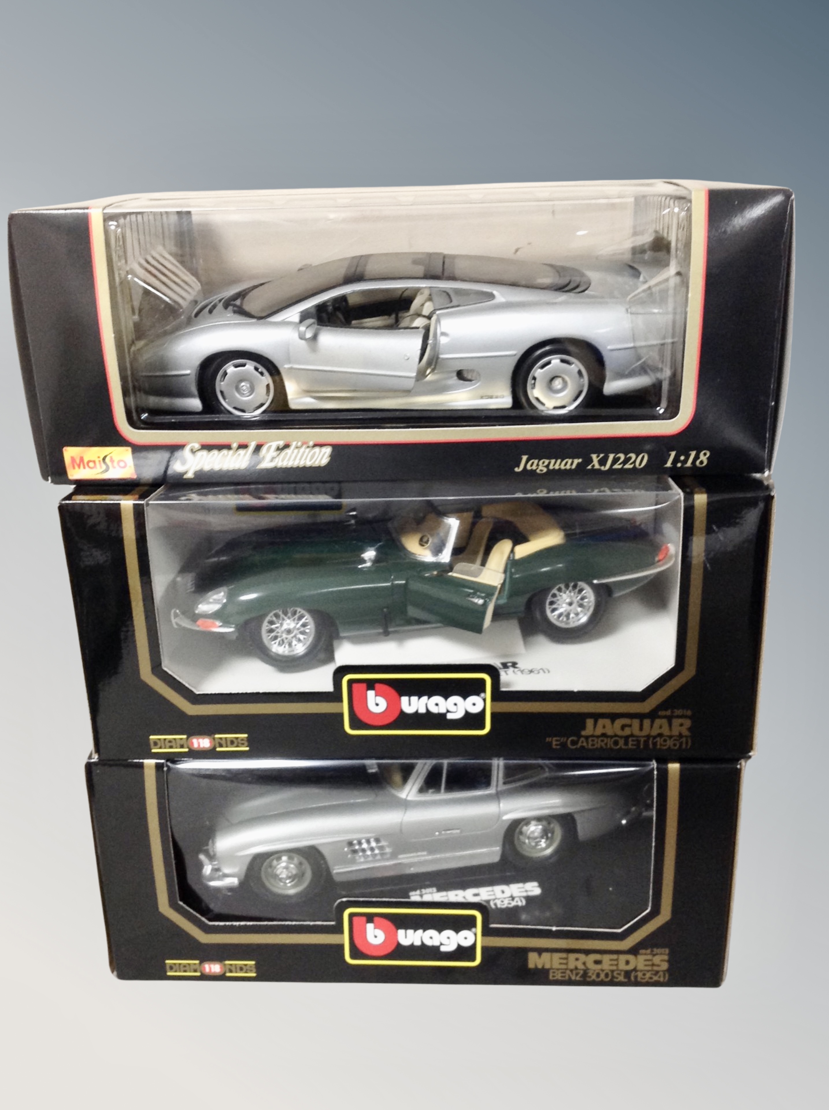 Two boxed Burago die cast vehicles 1:18 scale,