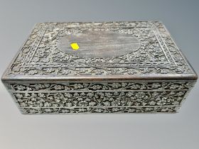 A heavily carved Anglo Indian jewellery box