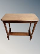 An Edwardian mahogany occasional table,