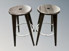 A pair of contemporary Vitra bar stools designed by Jean Prouvé,
