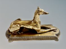 A 19th century French bronze figure of a recumbent greyhound on plinth,