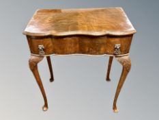 A Queen Anne style mahogany cutlery table on cabriole legs with later plate glass top,