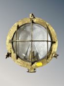 A brass bulkhead light from the hospital ship HMS Uganda