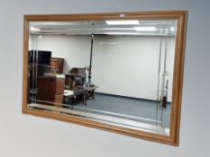 A contemporary pine framed bevelled mirror,