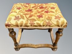 A William & Mary style walnut dressing table stool with shaped under stretcher,