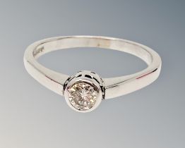 An 18ct white gold diamond solitaire ring, approximately 0.