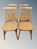 A set of four 20th century stained beech spindle backed dining chairs