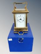 A heavy quality brass carriage clock with key by James Ritchie & Son, boxed.