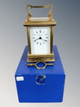A heavy quality brass carriage clock with key by James Ritchie & Son, boxed.