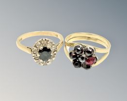 An 18ct gold sapphire and diamond ring and a gold garnet ring (2)