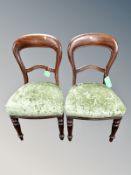 A pair of Victorian mahogany balloon backed dining chairs