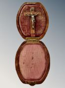 A 19th century travelling pocket crucifix in leather case