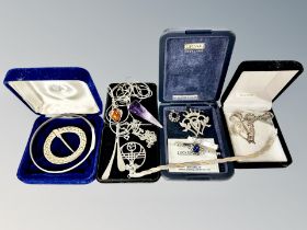 A group of silver jewellery including three tone twisted link bracelet, amber and amethyst pendants,