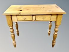 A contemporary pine two drawer side table,