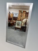 A contemporary silvered framed mirror 133 cm x 72 cm