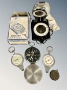 A walking compass in box together with four other compasses
