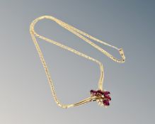 An 18ct gold ruby and diamond necklace, 12.45g. CONDITION REPORT: Chain length 42 cm.