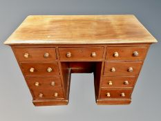 A Victorian mahogany twin pedestal nine drawer desk,