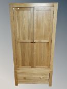 A contemporary oak wardrobe,