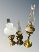 Three brass oil lamps