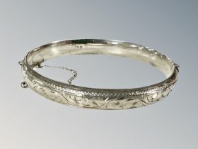 An engraved silver bangle CONDITION REPORT: 12.