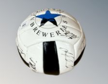 A Newcastle United football bearing many signatures