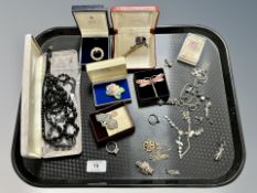 A collection of costume jewellery, brooches, rings,