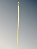 A walking cane with cast metal skull pommel length 79 cm