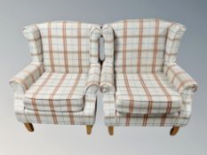 A pair of contemporary oak framed armchairs in checkered fabric