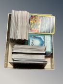 A collection of Pokemon and Yu-gi-oh! cards